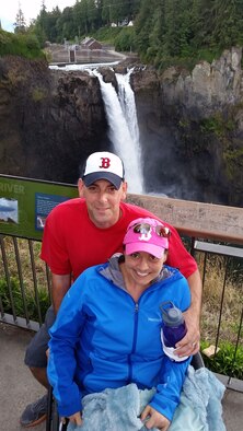 U.S. Air Force Tech. Sgt. Fred Dutton, a communications flight chief with the 5th Air Support Operations Squadron at Joint Base Lewis-McChord, Wash., is pictured with his wife, Jennifer Dutton, Sept. 5, 2015 at Snoqualmie Falls in Washington. Jennifer was diagnosed with Stage IV colon cancer in Aug. 2014. The bile drainage tube in her side, combined with chemotherapy limited her to a wheel chair until around the beginning of Nov. 2015, but the Dutton’s still managed to get out and enjoy a beautiful day. (Courtesy photo) 