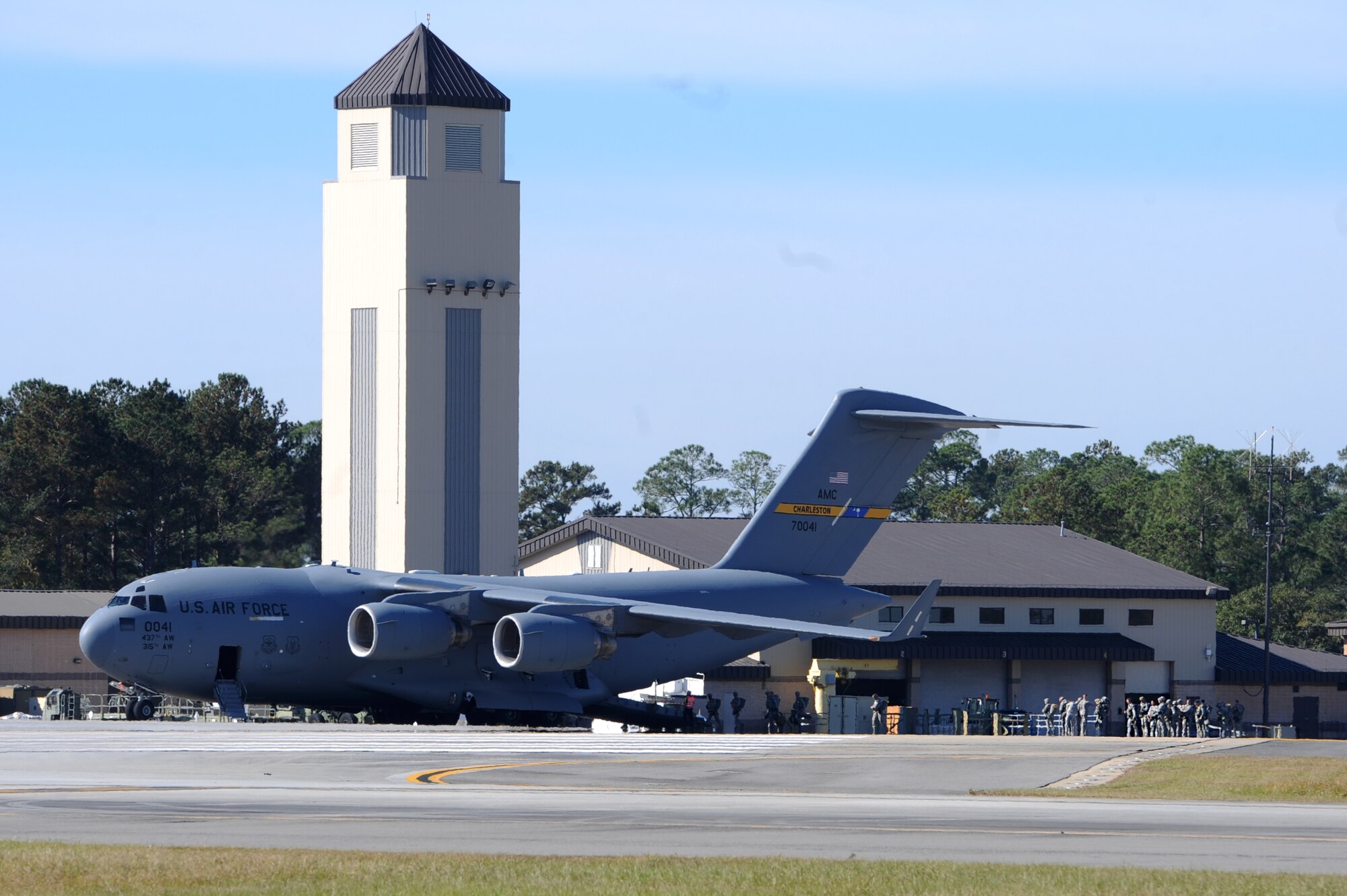 Airmen from the 820th Base Defense Group, board a C-17 Globemaster III before a static-line jump, Dec. 12, 2015, at Moody Air Force Base, Ga. The aircraft is stationed at Charleston Air Force Base, S.C., and was used for static-line jump training. (U.S. Air Force photo by Airman 1st Class Kathleen D. Bryant/Released)
