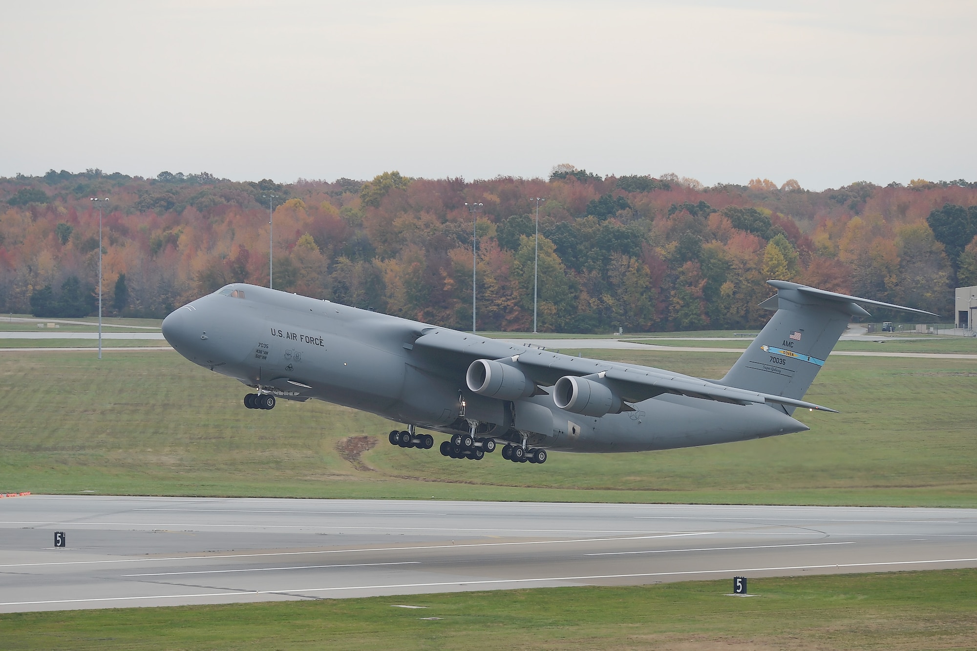A C-5M Super Galaxy takes off from the runway on Nov. 2, 2015, at Dover Air Force Base, Del. Take-off and landing data, also known as TOLD, is calculated and reviewed closely to ensure the aircraft is capable of safe flight. Team Dover is home to both C-5Ms and C-17A Globemaster III aircraft. (U.S. Air Force photo/Greg L. Davis)