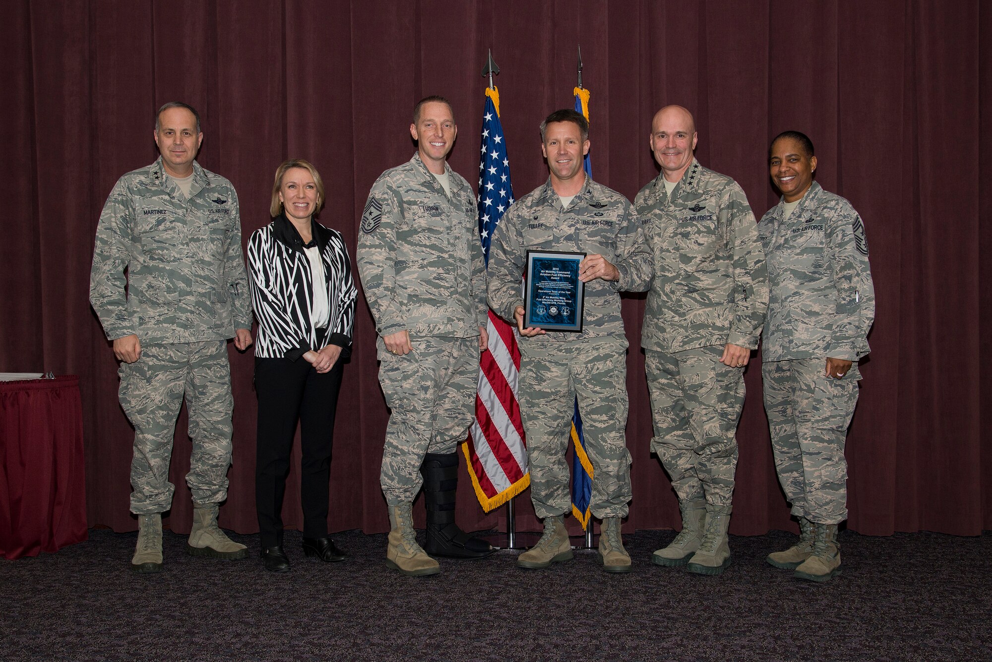 Gen. Carlton D. Everhart, commander of the Air Mobility Command, presents the 2015 Fuel Efficiency Operations Team of the Year award to Col. Daniel Tulley, commander of the 6th Air Mobility Wing, for the 6th Operations Support Squadron Dec. 3, 2015, during the 2015 AMC Phoenix Rally. Also in 2013 they were awarded the Small Team Fuel Efficiency Award. (Courtesy photo) 