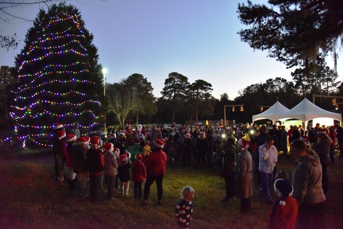 Carolers sang holiday songs during the annual Christmas tree lighting ceremony at Joint Base Charleston - AB on Dec. 8, 2015 in Charleston, S.C. Hot chocolate was served and Santa came to visit with the children. (photo by Jessica Donnelly/JB Charleston FSS)