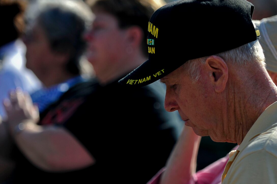 Peter Munsell, retired U.S. Sailor, listens to a guest speaker at the annual wreath laying ceremony at the Albert G. Horton, Jr., Memorial Veterans Cemetery in Suffolk, Va., Dec. 12, 2015. The ceremony also featured numerous guest speakers, an invocation and the playing of Taps. (U.S. Air Force photo by Senior Airman Breonna Veal)