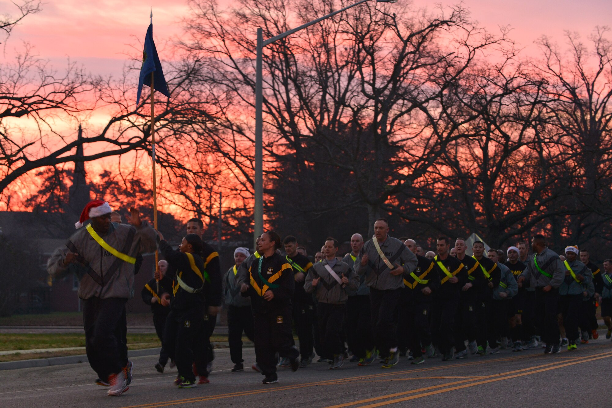 U.S. Army Sgt. Major James H. Jackson, the command sergeant major of the 733rd  Mission Support Group, leads Joint Base Langley-Eustis personnel in the annual holiday run at Fort Eustis, Va., Dec. 11, 2015. U.S. Service members from across the joint base’s installations participated in the event to strengthen joint partnerships. (U.S. Air Force photo by Staff Sgt. Natasha Stannard)