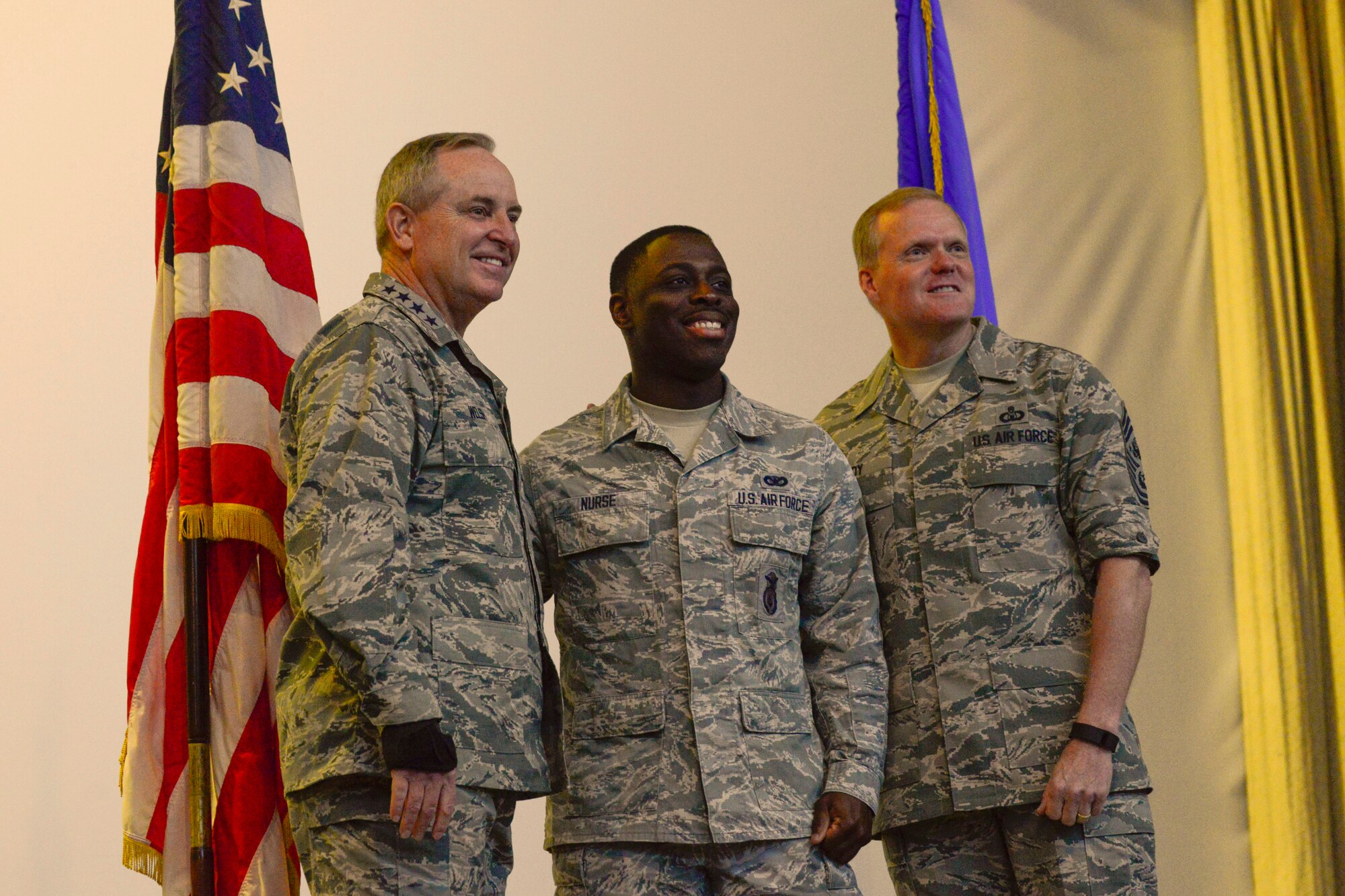 Air Force Chief of Staff Gen. Mark A. Welsh III and Chief Master Sgt. of the Air Force James A. Cody, pose for a photo with Senior Airman Wilon Nurse 496th Air Base Squadron security forces flight member after an all-call at Morón Air Base, Spain, Dec. 8, 2015. Welsh and Cody visited Morón to engage with Airmen of the squadron. During the visit, they thanked Airmen for their dedication to the mission and personal sacrifices. The leaders also made time to discuss and answer questions about recent changes to performance reporting systems and how they will affect future promotions. (courtesy photo)