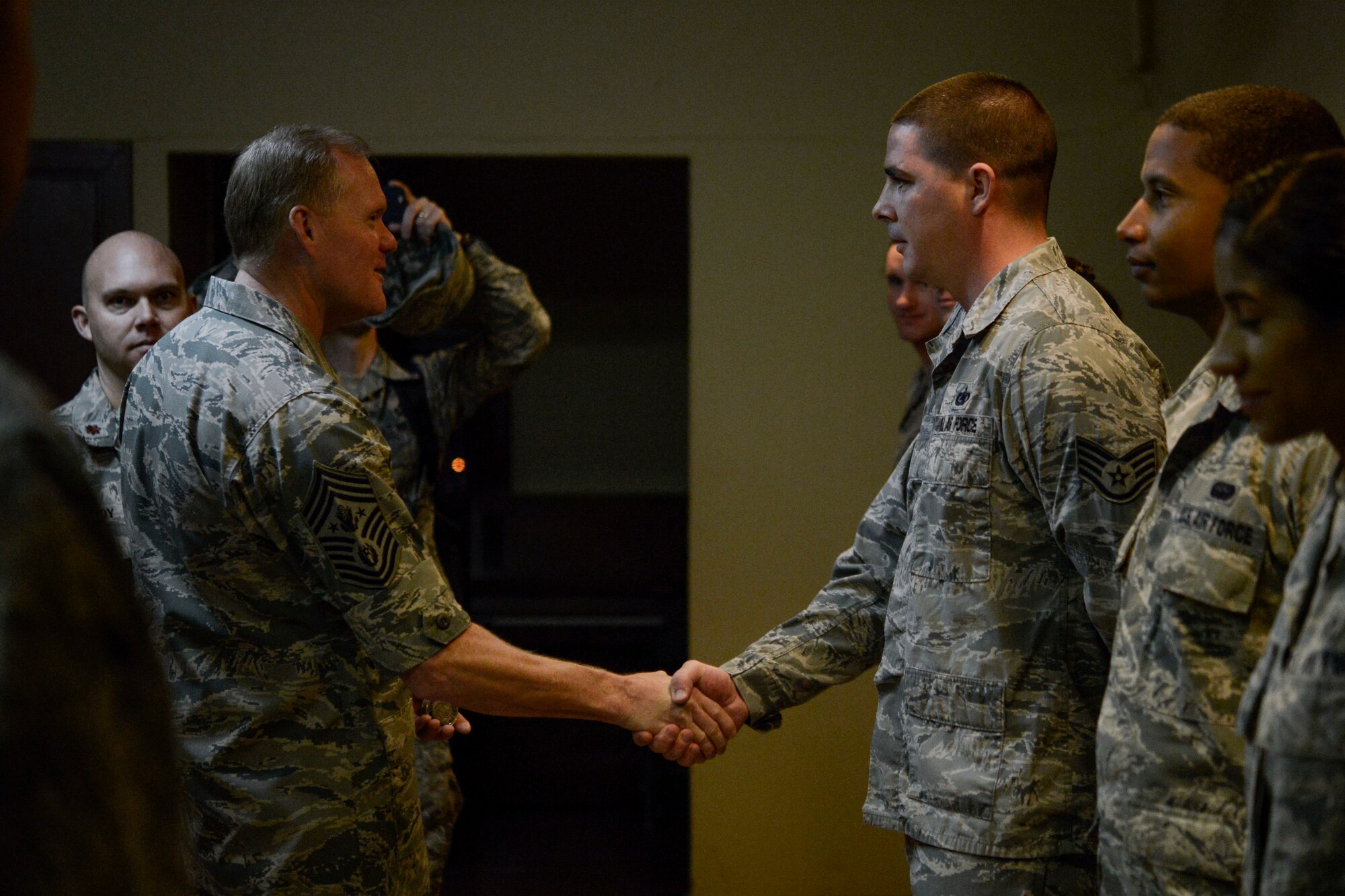 Chief Master Sgt. of the Air Force James A. Cody greets Airmen before an all-call at Morón Air Base, Spain, Dec. 8, 2015. Air Force Chief of Staff Gen. Mark A. Welsh III and Cody visited the air base to engage with Airmen in the European theatre. During the visit, they thanked the Airmen for their dedication to the mission and time spent away from their families. The leaders also discussed and answered questions about changes to performance reporting systems and how they will affect future promotions. (courtesy photo)
