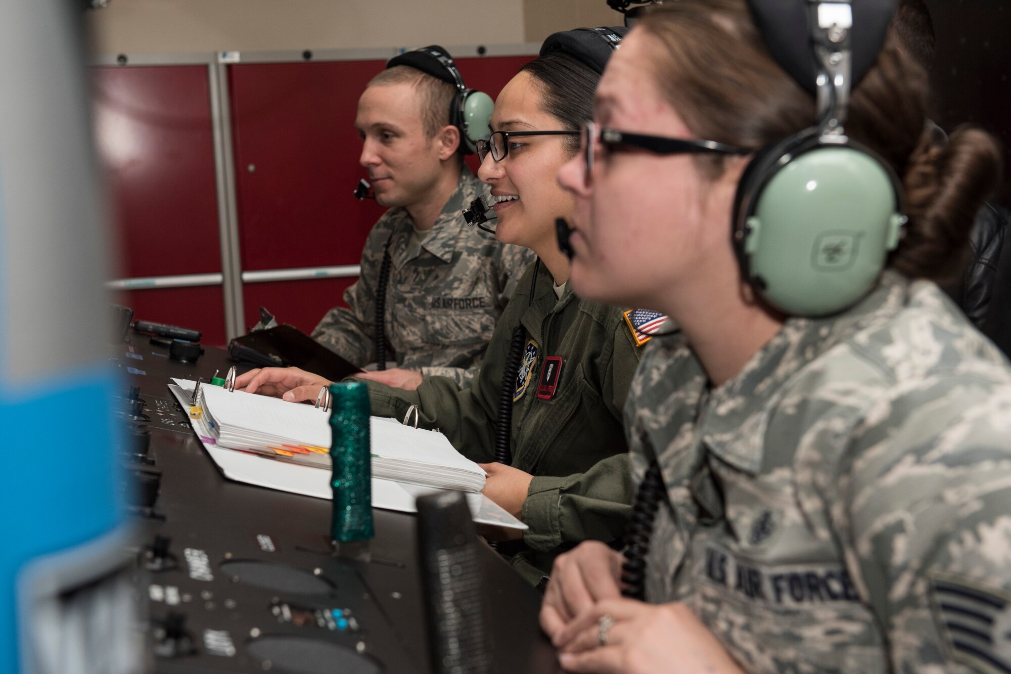 PETERSON AIR FORCE BASE, Colo. – Airmen from the Aerospace and Physiology Operations Flight monitor students during their refresher helicopter training course in a high altitude chamber Dec. 10, 2015. Each position - crew chief, instructor and recorder – is integral to the success of the mission where students are taken to a simulated 25,000 feet to feel the effects of low oxygen at high altitudes and know how their body reacts in a safe environment. In addition, the students learn how to respond to any adverse effects low oxygen may have to keep themselves and their passengers safe in flight. (U.S. Air Force photo by Senior Airman Rose Gudex)