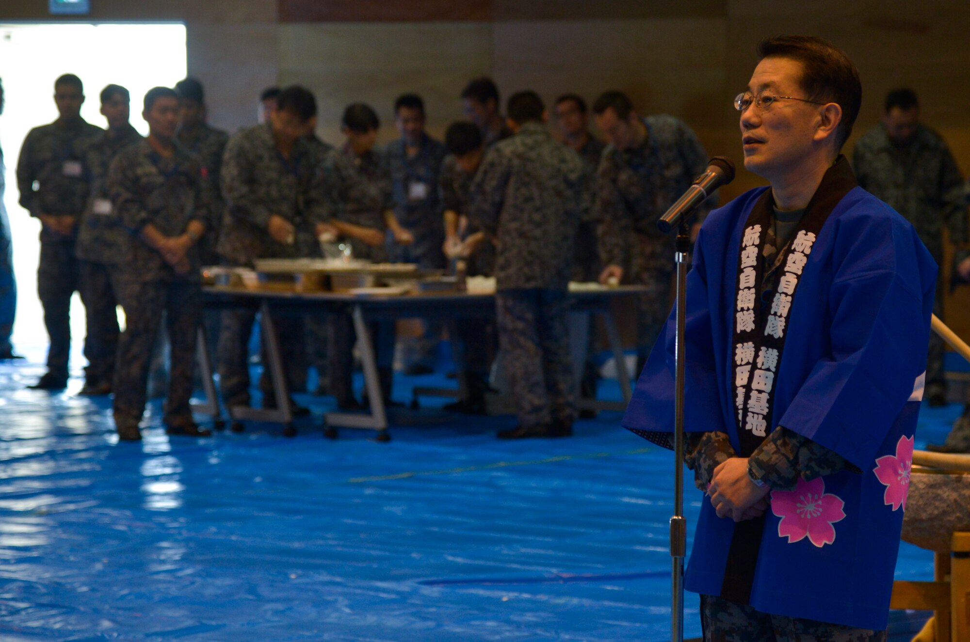 Col. Shuichi Kamada, Japan Air Self-Defense Force Operations Support Wing commander, provides opening remarks during a Mochitsuki ceremony at Yokota Air Base, Japan, Dec. 10, 2015. Mochitsuki is often performed by traditional, rural, or wealthier households in preparation for New Year celebration. (U.S. Air Force photo by Senior Airman David Owsianka/Released)