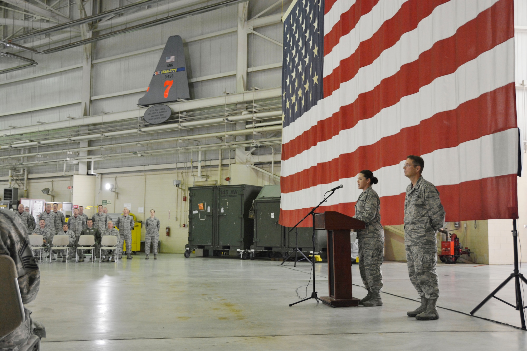 U.S. Air Force Lt. Col. Karen Shook, commander of the 145th Aircraft Maintenance Squadron,(AMXS) addresses fellow Airmen, friends and family following her promotion ceremony held at the North Carolina Air National Guard Base, Charlotte Douglas International Airport, Nov. 7, 2015. Shook, who earned her Master’s Degree at Appalachian State University, was a speech pathologist before coming to the NCANG full time. In December 2014 Shook became the first female commander for the 145th AMXS. (U.S. Air National Guard photo by Master Sgt. Patricia F. Moran, 145th Public Affairs/Released)