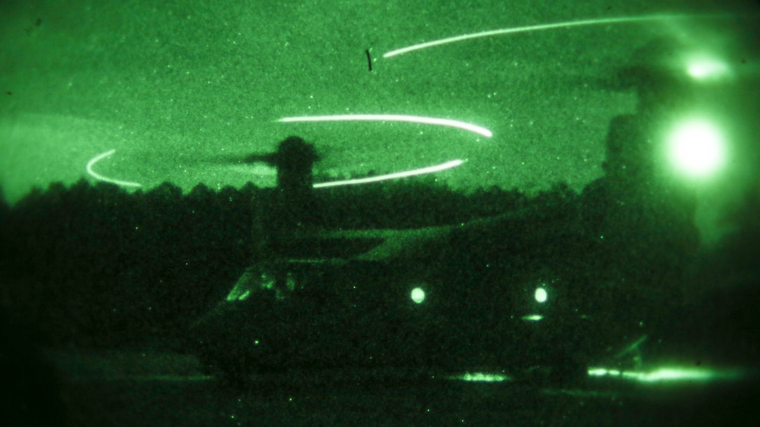 An MV-22B Osprey, operated by a crew with Marine Medium Tiltrotor Training Squadron 204, lands during a night time external lifts operation at Marine Corps Base Camp Lejeune, N.C., Dec. 14, 2015. Marines with 2nd Transportation Support Battalion supported the exercise to facilitate the required flight hours for student pilots, and practice their own skills as a helicopter support team securing transportation of resources for Marines that would need it in a real-world operation.