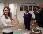 Jennifer Rohrer, DLA Distribution Headquarters, chooses her prize during the CFC cake walk on Dec. 9.
