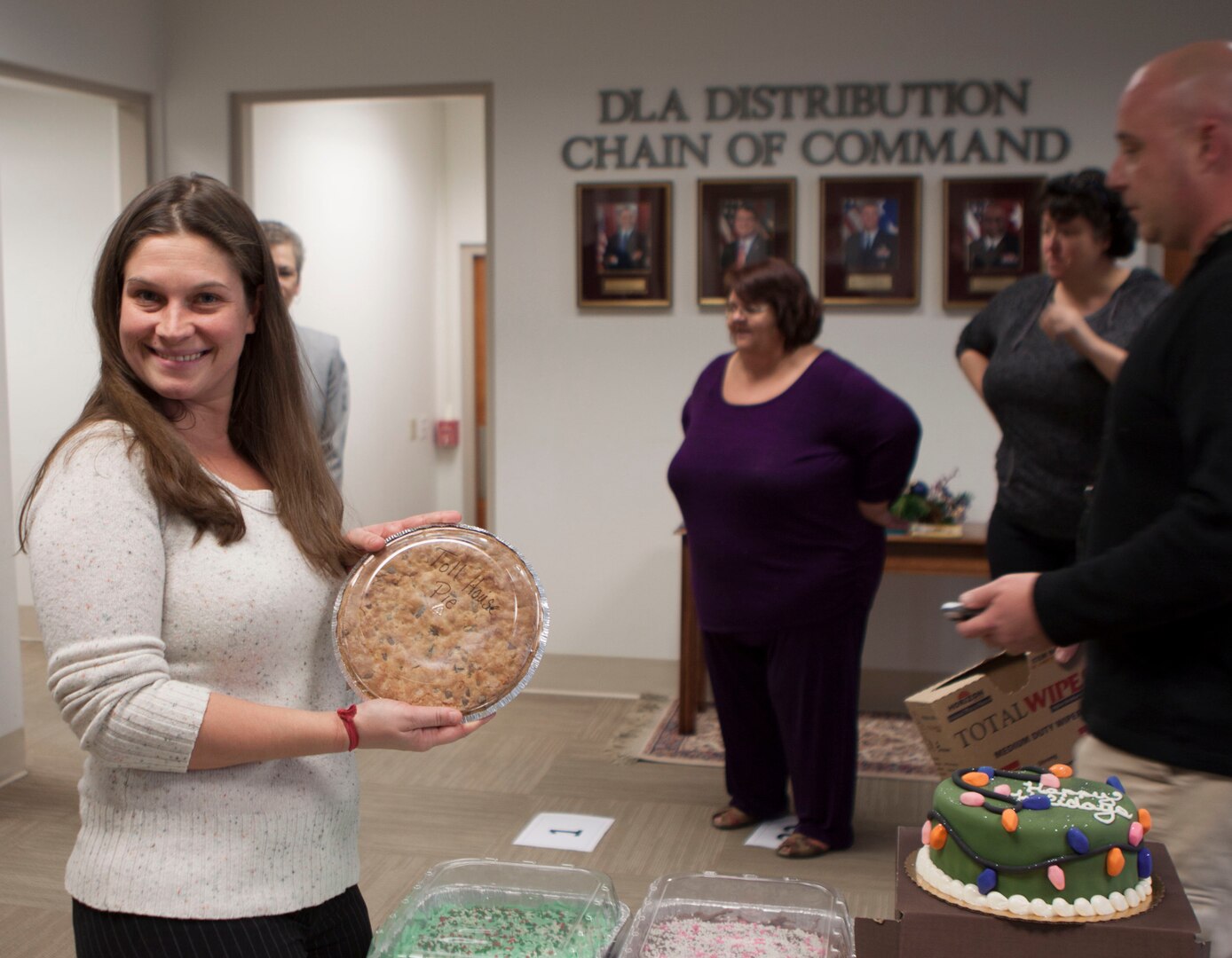 Jennifer Rohrer, DLA Distribution Headquarters, chooses her prize during the CFC cake walk on Dec. 9.