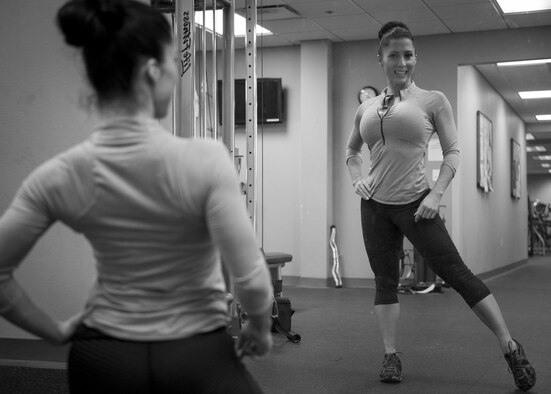 1st Lt. Bobbie-Jean Johnson, 919th Special Operations Wing, uses a full-length mirror to practice competition poses at the fitness center on Duke Field, Fla. In November 2015, the Air Force Reservist won every division she entered at the Northwest Florida Flex Fest in Pensacola. (U.S. Air Force photo/Tech. Sgt. Jasmin Taylor)