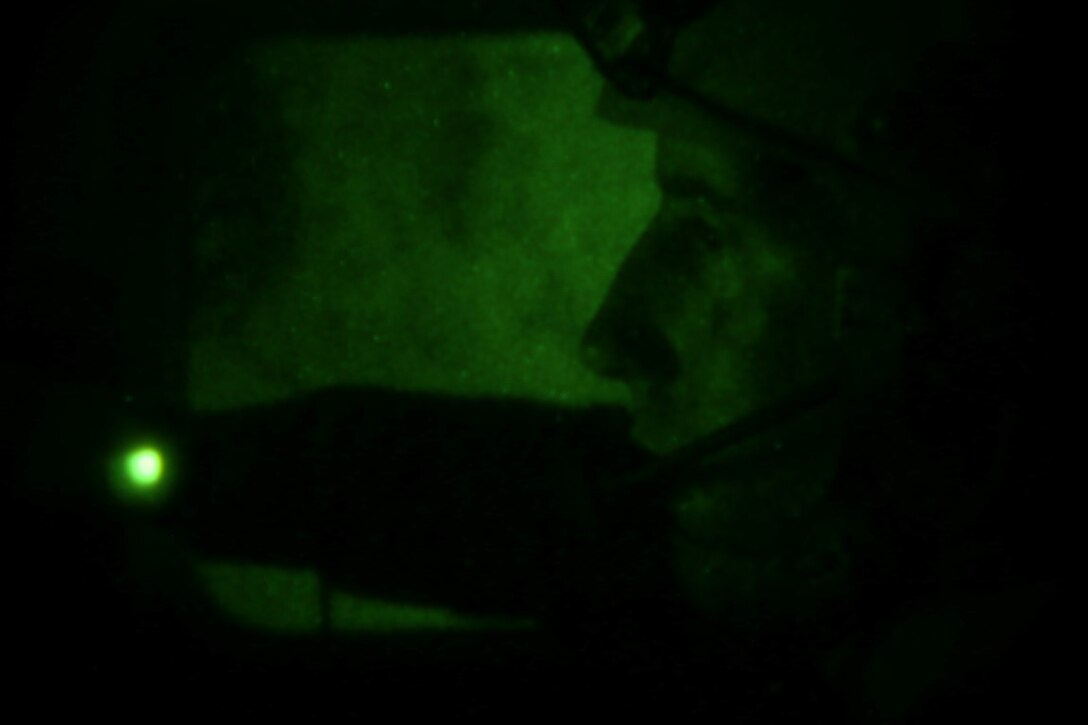 Lance Cpl. Mark Toub Jr., from Boyertown, Pa., and pointman with Company A, 1st Reconnaissance Battalion, 1st Marine Division, awaits insertion during reconnaissance and surveillance training, Nov. 19-21, 2015, aboard Marine Corps Training Area Bellows, Hawaii. The Marines conducted insertion, infiltration, execution, exfiltration, and extraction in terrain unfamiliar to what is usually found at their home base in California. The Hawaiian terrain ranged from beach shores, to dense jungle and open valleys during pouring rains. (U.S. Marine Corps photo by Sgt. Tony Simmons)