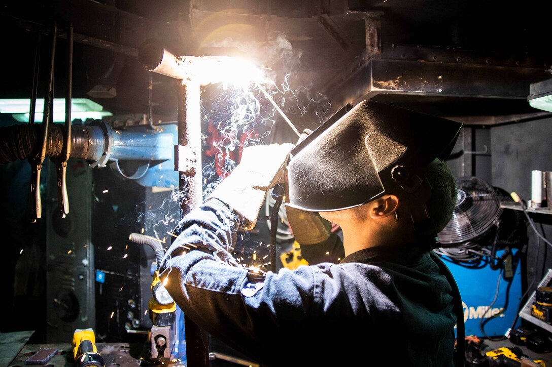 Navy Seaman Kaleb Weese practices welding aboard the aircraft carrier USS George Washington in Norfolk, Va., Dec. 15, 2015. U.S. Navy photo by Petty Officer 2nd Class Jonathan Nelson
