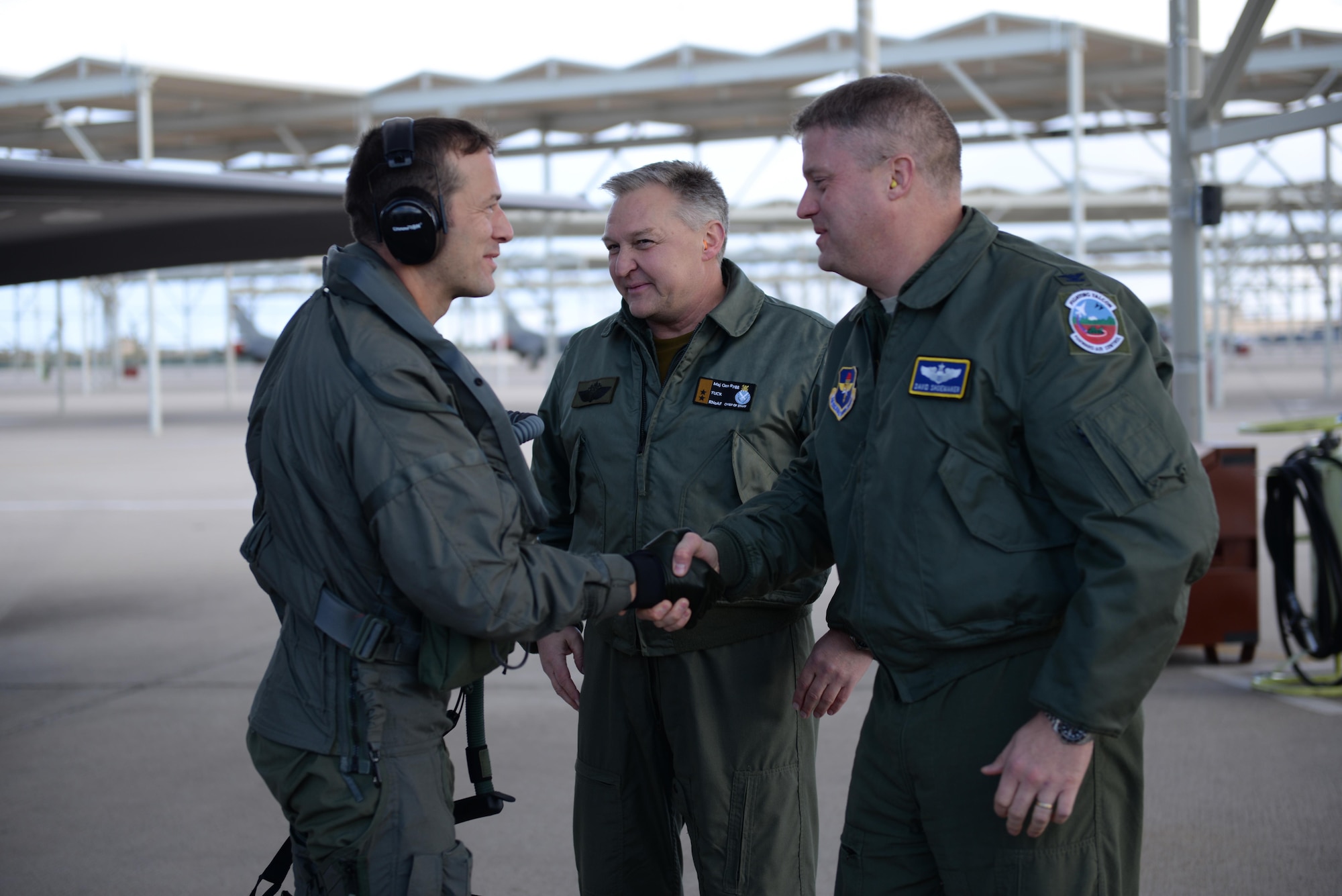 Royal Norwegian Air Force Maj. Morten Hanche, a 62nd Fighter Squadron student pilot, shakes the hand of Col. David Shoemaker, the 56th Fighter Wing vice commander, in front of Maj. Gen. Per-Egil Rygg, the Royal Norwegian Air Force chief of staff, after successfully completing a sortie in a Norwegian F-35 Lightning II Dec. 14, 2015, at Luke Air Force Base, Ariz. Hanche is the first Norwegian to fly an F-35, and is now the first Norwegian to have piloted a Norwegian-specific F-35. (U.S. Air Force photo/Airman 1st Class Ridge Shan)