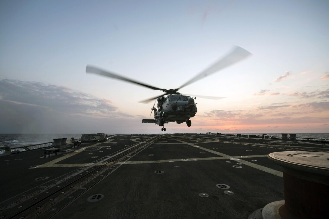 An MH-60R Sea Hawk helicopter lands aboard the USS Gravely in the Mediterranean Sea, Dec. 11, 2015. The Gravely is conducting naval operations in the U.S. 6th Fleet area of responsibility in support of U.S. national security interests in Europe and Africa. U.S. Navy photo by Petty Officer 2nd Class D. C. Dillon
