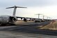 Eleven C-17 Globemaster IIIs line up on the Moses Lake runway Dec. 10, 2015, after an airdrop during exercise Rainier War at Moses Lake, Wash. Rainier War is a semiannual large formation exercise, hosted by the 62nd Airlift Wing, designed to train aircrews under realistic scenarios that support a full spectrum operations against modern threats and replicate today's contingency operations. (U.S. Air Force photo/Senior Airman Divine Cox)
