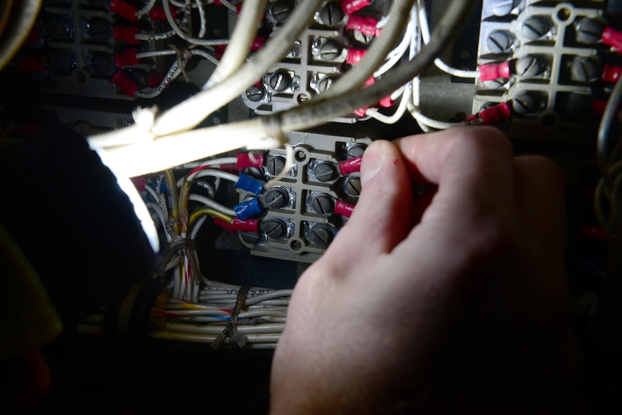 Airman 1st Class Sean Carnahan, 2nd Maintenance Squadron electrical and environmental technician, checks wiring connections on a B-52 Stratofortress at Barksdale Air Force Base, La., Dec. 15, 2015. Electrical systems power everything from life support systems to cabin pressure, and if aircraft loses power than it can become a problem for pilots and the mission. (U.S. Air Force Photo/Airman 1st Class Luke Hill) 