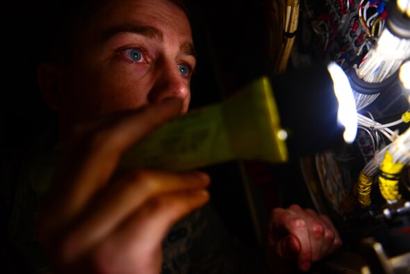 Airman 1st Class Sean Carnahan, 2nd Maintenance Squadron electrical and environmental technician, inspects a power box on a B-52 Stratofortress at Barksdale Air Force Base, La., Dec. 15, 2015. E and E Airmen have a broad maintenance responsibility that includes electrical and life-support systems on the B-52. (U.S. Air Force Photo/Airman 1st Class Luke Hill)