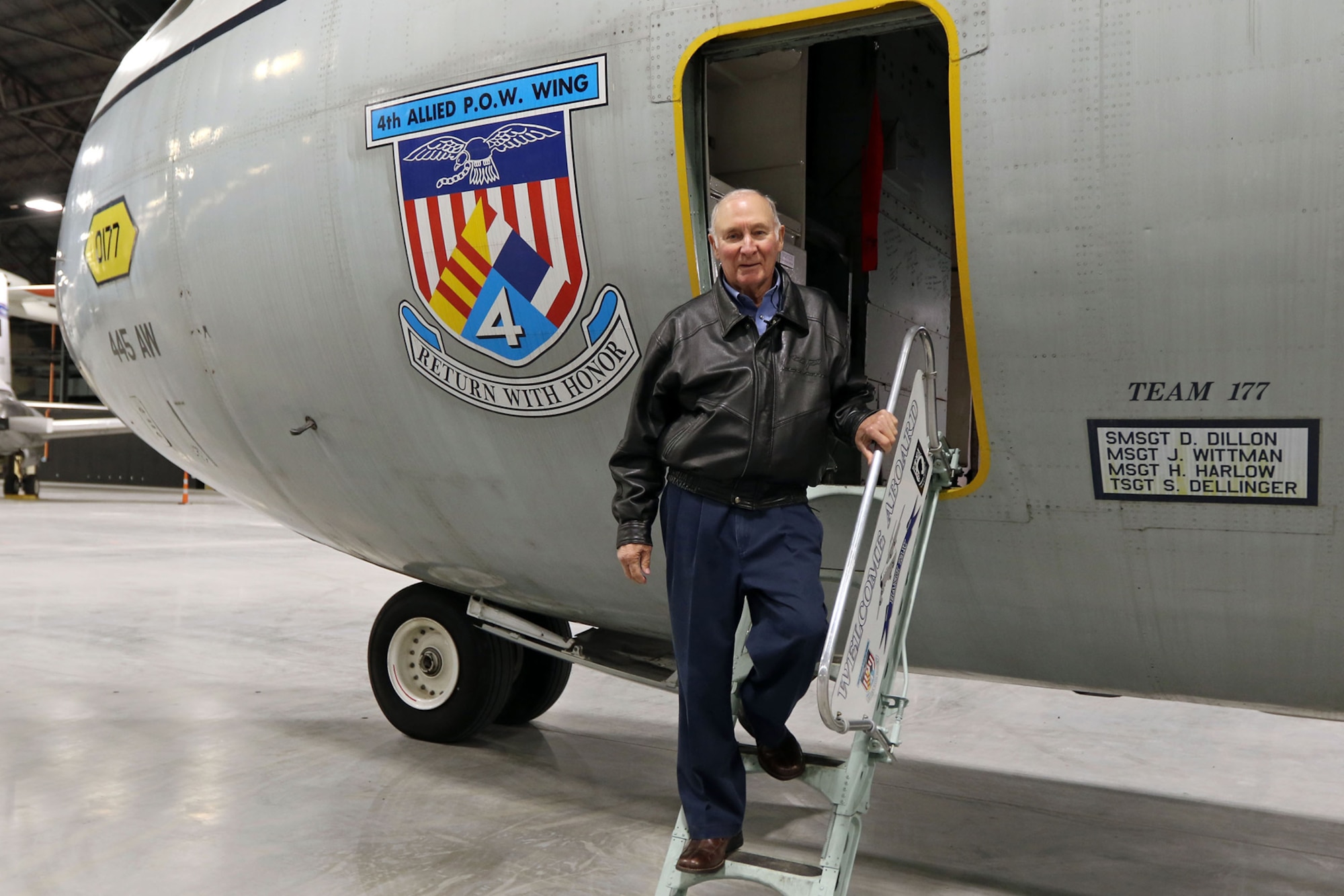 Lt. Col. (Ret.) Paul Kari, a former prisoner of war in Vietnam, poses with the Lockheed C-141C Hanoi Taxi in the new fourth building at the National Museum of the U.S. Air Force on Dec. 16, 2015. Kari was flown to freedom on the Hanoi Taxi in 1973. (U.S. Air Force photo by Don Popp)