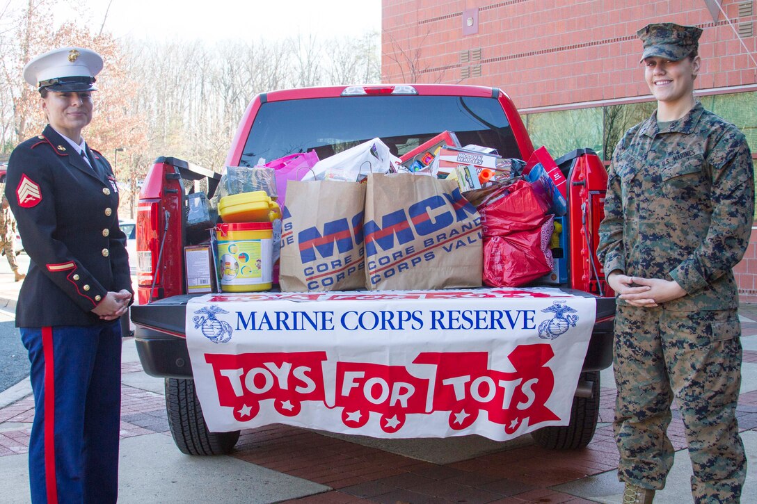 U.S. Marines with Marine Corps Recruiting Command collected cash donations or an unwrapped gift for Toys for Tots outside of the Marsh Center, Quantico, Va., Dec. 16, 2015. The Marines accepted donations before Marines and civilians left the office for the holidays. Toys for Tots was established in 1947 by the U.S. Marine Corps Reserves to donate toys for less fortunate children in communities around the nation. (U.S. Marine Corps photo by Lance Cpl. Shaehmus R. Sawyer/released)