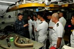 SUBIC BAY, Philippines (Dec. 11, 2015) Mass Communications Specialist 1st Class Brandon Shelander, from the submarine tender USS Emory S. Land (AS 39), gives members of the Philippine Navy a tour of Emory S. Land’s repair facilities following a subject matter expert exchange held onboard. The exchange gave participants a chance to share maintenance philosophies in a relaxed environment. Emory S. Land is a forward deployed expeditionary submarine tender on an extended deployment conducting coordinated tended moorings and afloat maintenance in the U.S. 5th and 7th Fleet areas of operations. (U.S. Navy photo by Mass Communication Specialist Seaman Tiffany L. Downey/Released)