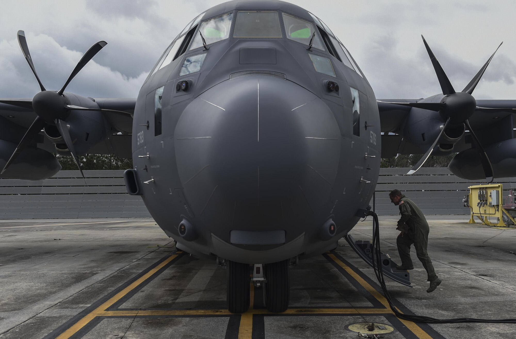 Col. Sean Farrell, commander of the 1st Special Operations Wing, boards an MC-130J Commando II at Lockheed Martin in Marietta, Ga., Dec. 11, 2015. The MC-130J will undergo modifications to become an AC-130J Ghostrider, which will provide the 1 SOW with close air support and air interdiction capabilities. (U.S. Air Force photo by Senior Airman Ryan Conroy)