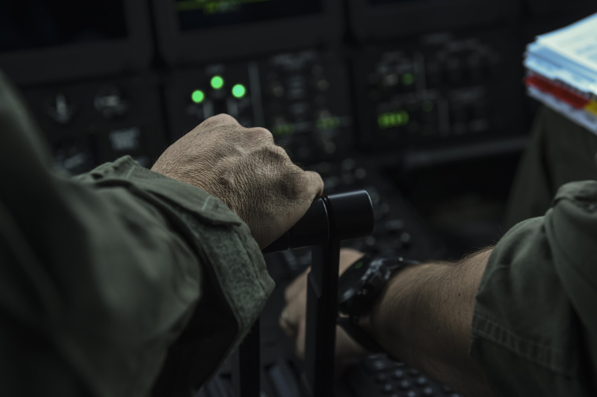 Col. Sean Farrell, commander of the 1st Special Operations Wing, takes hold of the throttle for takeoff at Lockheed Martin in Marietta, Ga., Dec. 11, 2015. The MC-130J will undergo modifications to become an AC-130J Ghostrider, which will provide the 1 SOW with close air support and air interdiction capabilities. (U.S. Air Force photo by Senior Airman Ryan Conroy)