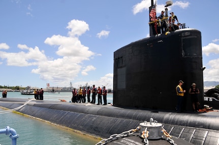 PEARL HARBOR (July 8, 2014) Crew members of the Los Angeles-class fast attack submarine USS Santa Fe (SSN 763) prepare to depart for the at-sea portion of Rim of the Pacific (RIMPAC) Exercise 2014. Twenty-two nations, more than 40 ships and submarines, about 200 aircraft and 25,000 personnel are participating in Exercise RIMPAC from June 26 to Aug. 1 in and around the Hawaiian Islands and Southern California. The world's largest international maritime exercise, RIMPAC provides a unique training opportunity that helps participants foster and sustain the cooperative relationships that are critical to ensuring the safety of sea lanes and security on the world's oceans. RIMPAC 2014 is the 24th exercise in the series that began in 1971. (U.S. Navy photo by Mass Communication Specialist 1st Class Steven Khor/Released)                       