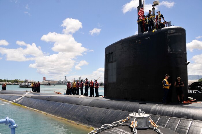 PEARL HARBOR (July 8, 2014) Crew members of the Los Angeles-class fast attack submarine USS Santa Fe (SSN 763) prepare to depart for the at-sea portion of Rim of the Pacific (RIMPAC) Exercise 2014. Twenty-two nations, more than 40 ships and submarines, about 200 aircraft and 25,000 personnel are participating in Exercise RIMPAC from June 26 to Aug. 1 in and around the Hawaiian Islands and Southern California. The world's largest international maritime exercise, RIMPAC provides a unique training opportunity that helps participants foster and sustain the cooperative relationships that are critical to ensuring the safety of sea lanes and security on the world's oceans. RIMPAC 2014 is the 24th exercise in the series that began in 1971. (U.S. Navy photo by Mass Communication Specialist 1st Class Steven Khor/Released)                       