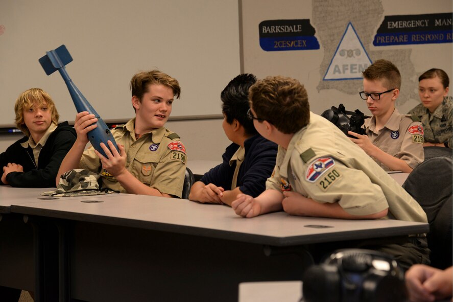 Boy Scout 2150 troops receive a briefing on chemical, biological, radiological and nuclear threats at 2nd Civil Engineer Squadron Emergency Management Flight on Barksdale Air Force Base, La., Dec. 11, 2015. The scouts toured the base to experience Air Force customs and various military careers. (U.S. Air Force photo/Senior Airman Jannelle Dickey)