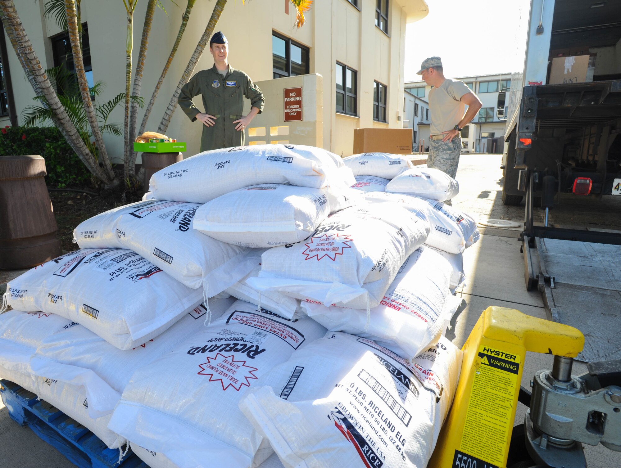 Members from Pacific Air Forces A5/8 Directorate of Strategy, Plans and Programs donate food to a local Hawaii food bank, Dec. 15, 2015, Joint Base Pearl Harbor-Hickam, Hawaii. The Airmen collected and donated more than 2,500 pounds of food, to include rice and canned goods. (U.S. Air Force photo by Tech. Sgt. Amanda Dick/Released)