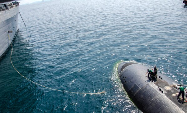 150514-N-ZZ999-094 PHUKET, Thailand (May 14, 2015) Sailors aboard the Los Angeles-class attack submarine USS Key West (SSN 722) heave in a mooring line as the submarine tender USS Emory S. Land (AS 39) prepares to moor Key West alongside during Guardian Sea 2015, an annual exercise with the Royal Thai Navy. Emory S. Land is a forward deployed expeditionary submarine tender on an extended deployment conducting coordinated tended moorings and afloat maintenance in the U.S. 5th and 7th Fleet areas of responsibility. (U.S. Navy photo by Mass Communication Specialist Seaman Apprentice Michael Doan/Released)                                                                                                                                                                                                                                                                     