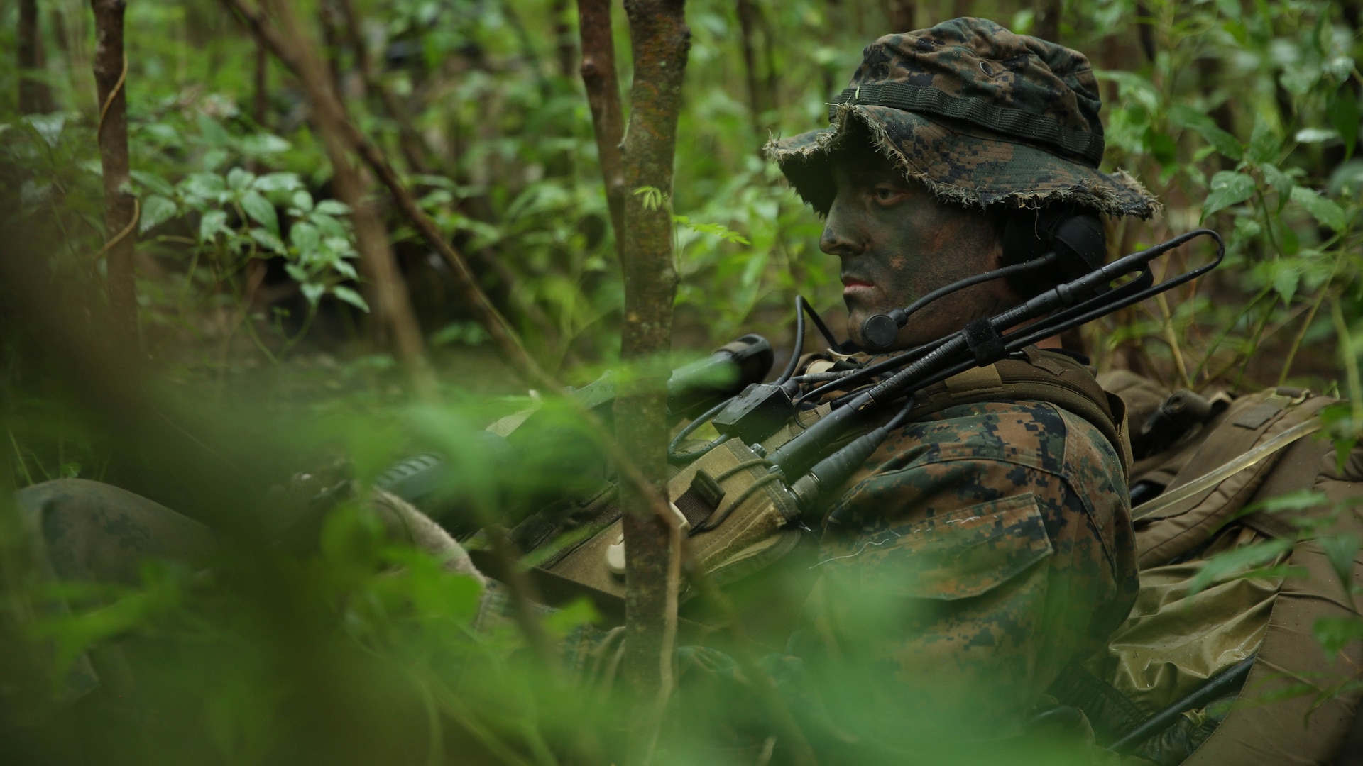 Corporal Scott Hunt, from Palm Bay, Florida, and pointman with Company A, 1st Reconnaissance Battalion, 1st Marine Division, rests during reconnaissance and surveillance training, Nov. 19-21, 2015, aboard Marine Corps Training Area Bellows, Hawaii. The Marines conducted insertion, infiltration, execution, exfiltration, and extraction in terrain unfamiliar to what is usually found at their home base in California. The Hawaiian terrain ranged from beach shores, to dense jungle and open valleys during pouring rains. 