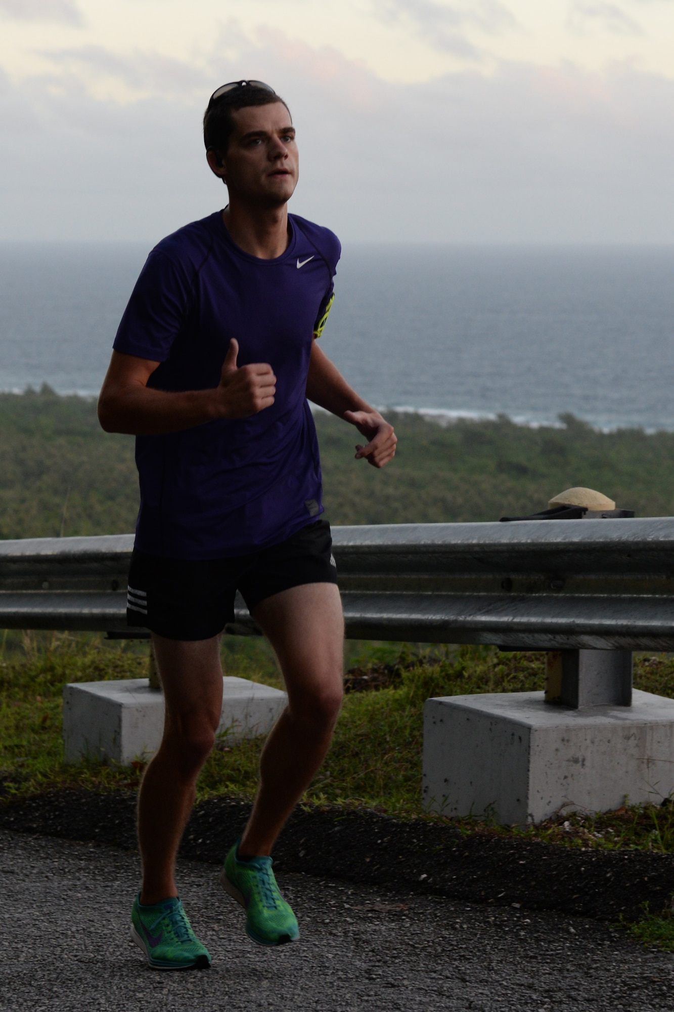 A runner makes his way uphill during the Saunders Slope Santa Shuffle Dec. 16 2015, at Andersen Air Force Base, Guam. Runners had two routes to choose from during the Santa Shuffle - a 5K along Tarague Beach or a 4.8 mile run up Sanders Slope. (U.S. Air Force photo/ Airman 1st Class Jacob Skovo)