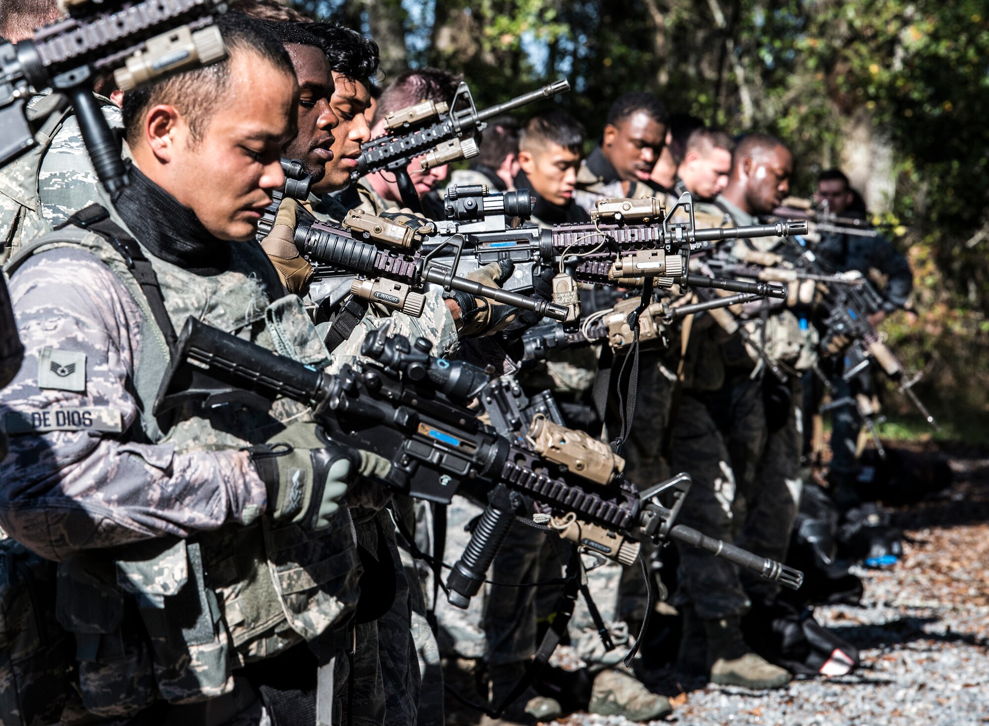 Airmen from the 822d Base Defense Squadron, clear their weapons after force-on-force training, Dec. 10, 2015, at Moody Air Force Base, Ga. Airmen cleared their weapons at the end of each exercise to ensure safety throughout the training day. (U.S. Air Force photo by Airman 1st Class Lauren M. Johnson/Released)