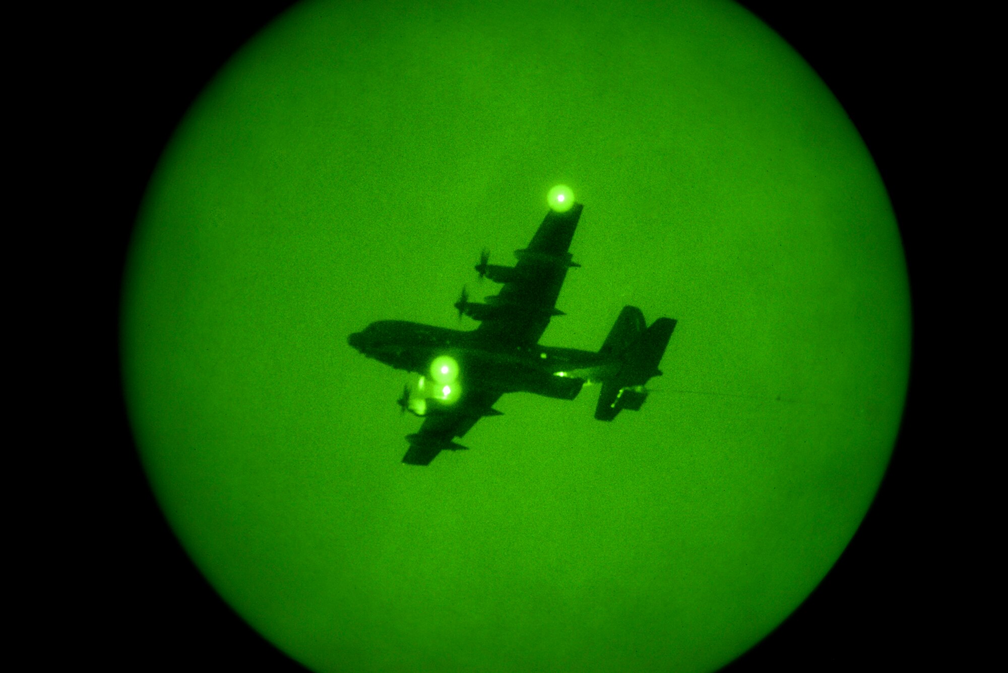 A U.S. Air Force HC-130J Combat King II from the 79th Rescue Squadron drops a heavy equipment training platform during aerial delivery and recovery training at Fort Huachuca, Ariz., Dec. 9, 2015.  The training platform weighed 3,500 pounds. (U.S. Air Force photo by Senior Airman Chris Massey/Released)