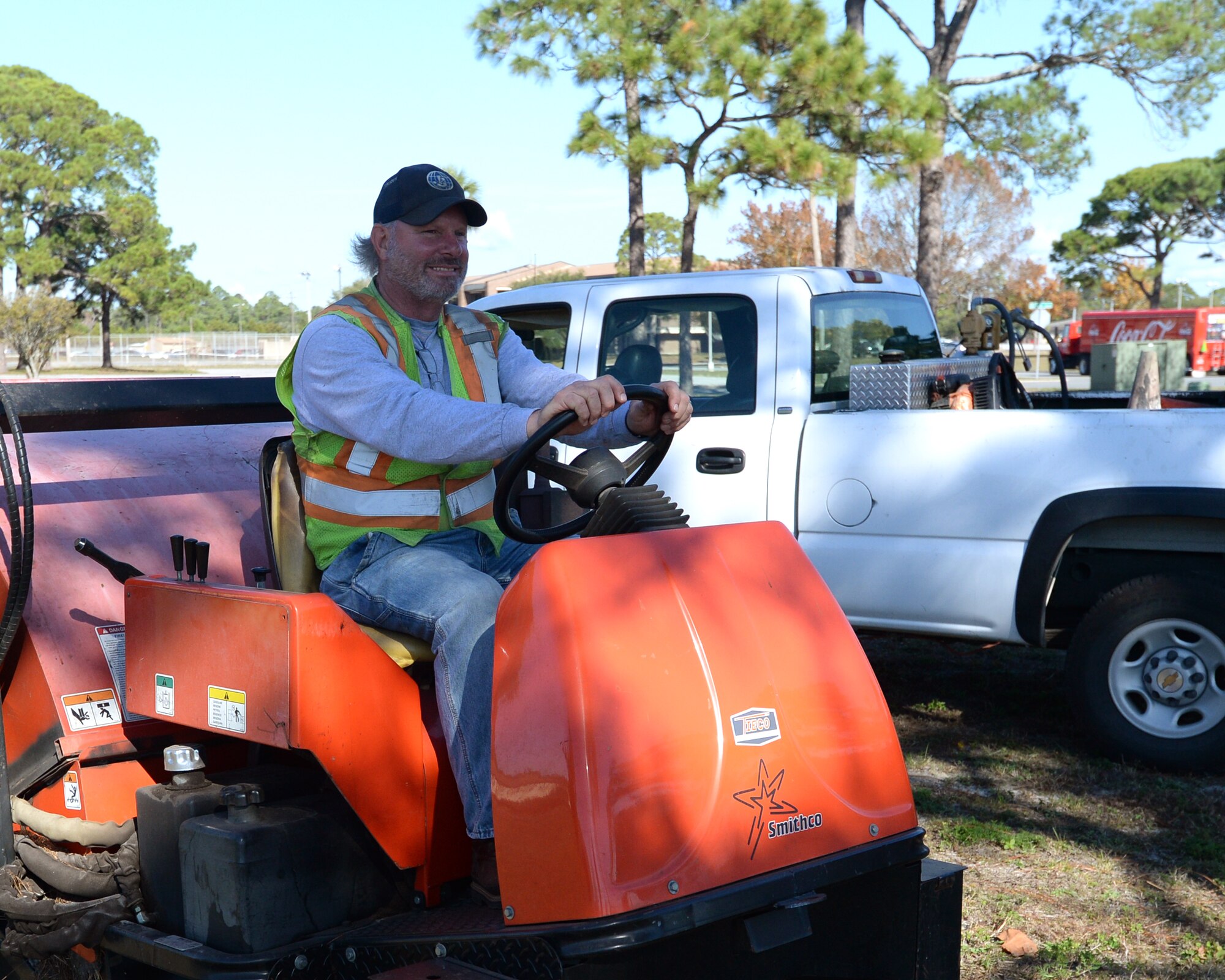 James Wobson, 325th Civil Engineering Squadron tractor operator, prepares to operate a landscaping mower.  The contractors that support the 325th CES play a vital role in keeping up the infrastructure of Tyndall AFB.  (U.S. Air Force photo by Airman 1st Class Cody R. Miller/Released)