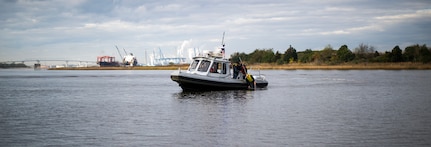 Sailors from the harbor patrol unit simulate a man-overboard exercise Dec. 9, 2015, on the Cooper River near Joint Base Charleston – Weapons Station, S.C. JB Charleston’s port operations recently implemented a new training program to effectively cut down on spending and improve resourcefulness. The training consisted of putting Sailors through a series of classes. The week following their classes, they were put to the test instructing newer Sailors on the information they just learned. (U.S. Air Force photo/Senior Airman Clayton Cupit)