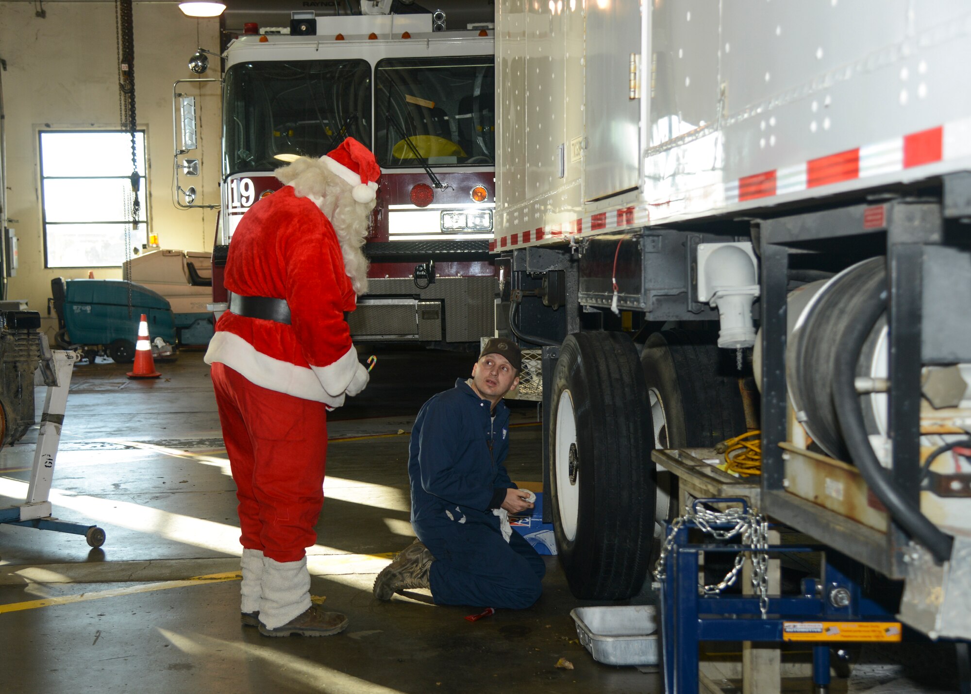 Santa Claus visits the 412th Logistics Readiness Squadron Vehicle Maintenance Bldg. (U.S. Air Force photo by Rebecca Amber)