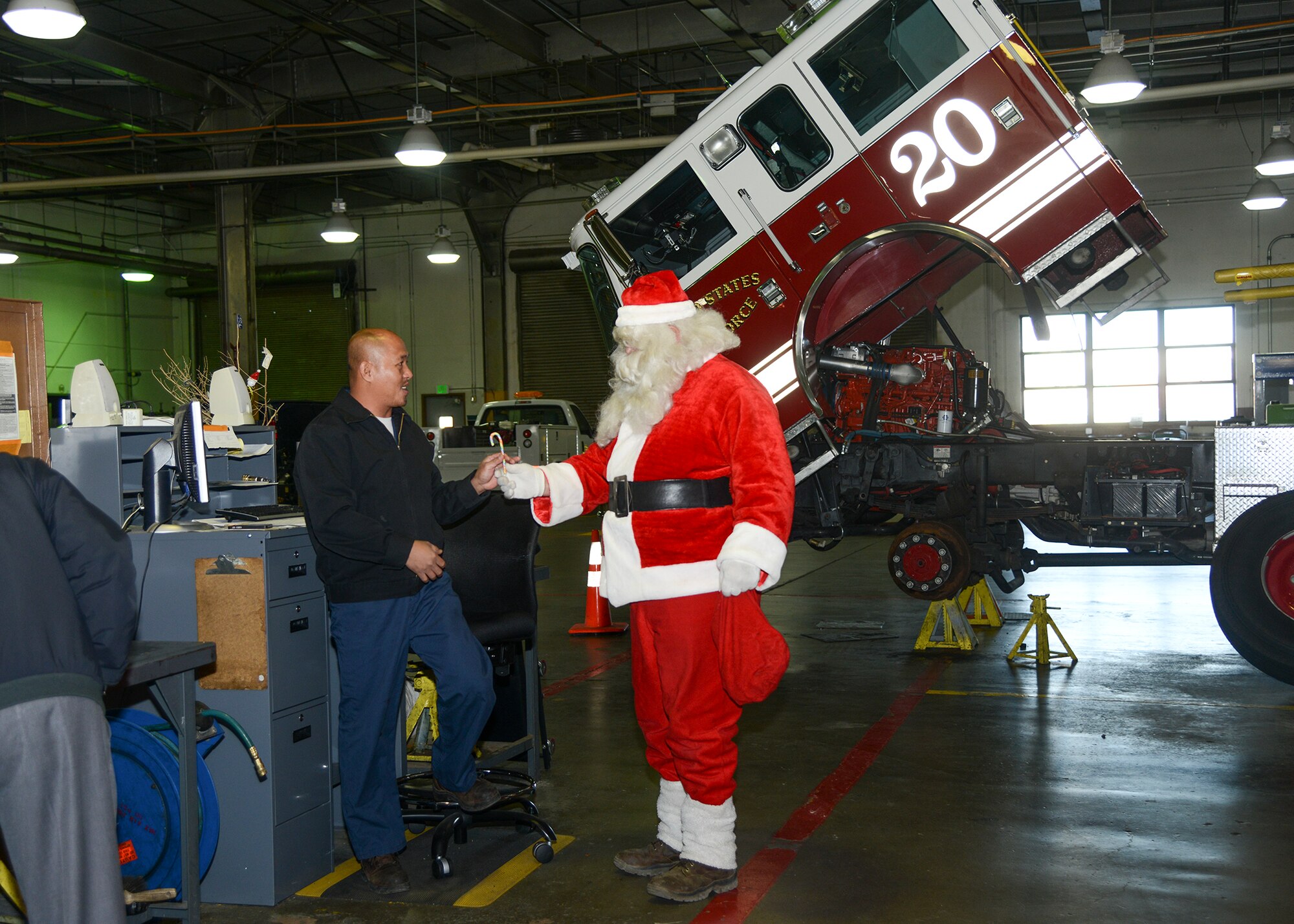 Santa Claus visits the 412th Logistics Readiness Squadron Vehicle Maintenance Bldg. (U.S. Air Force photo by Rebecca Amber)