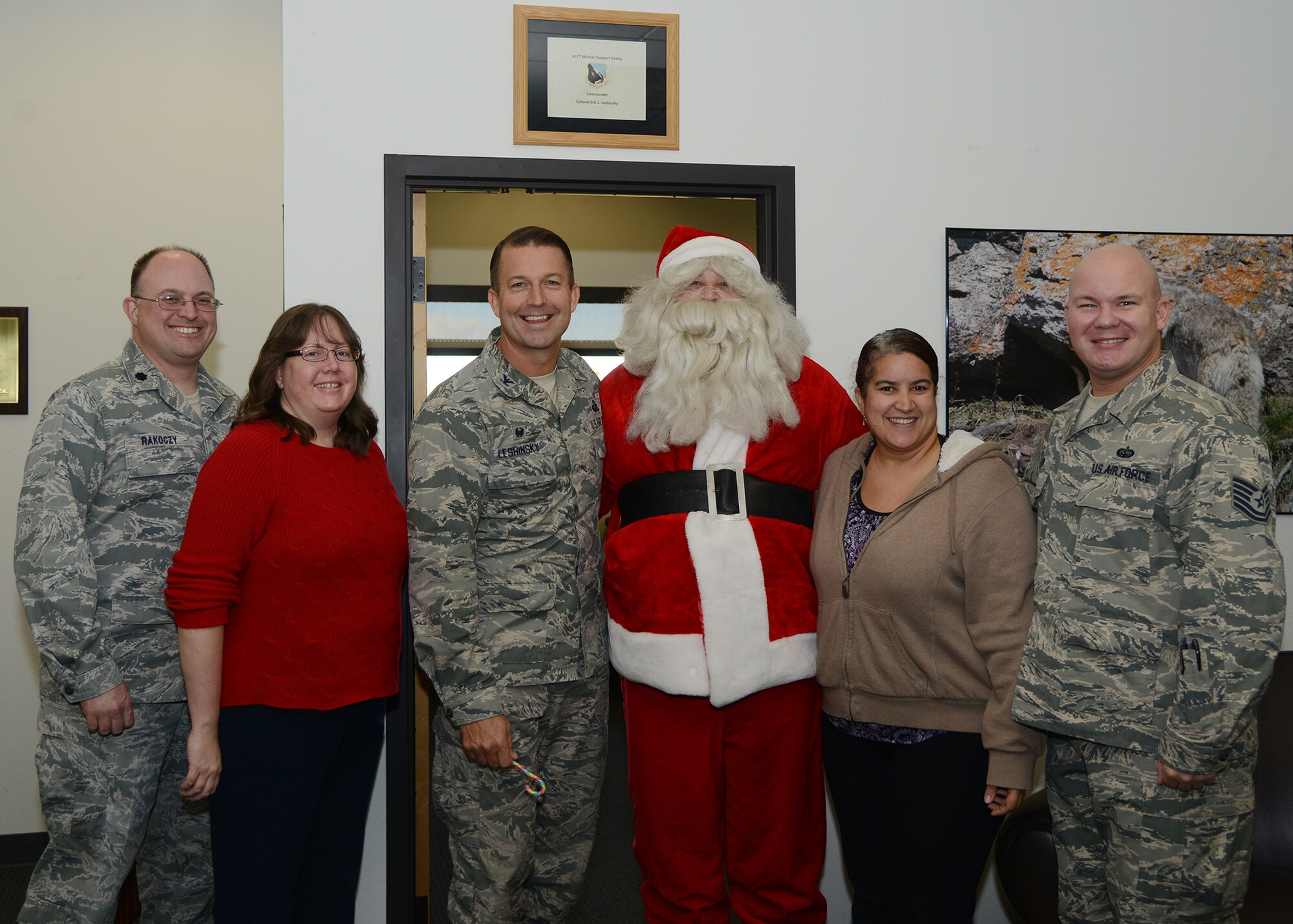Santa Claus and the 412th Mission Support Group front office. (U.S. Air Force photo by Rebecca Amber)