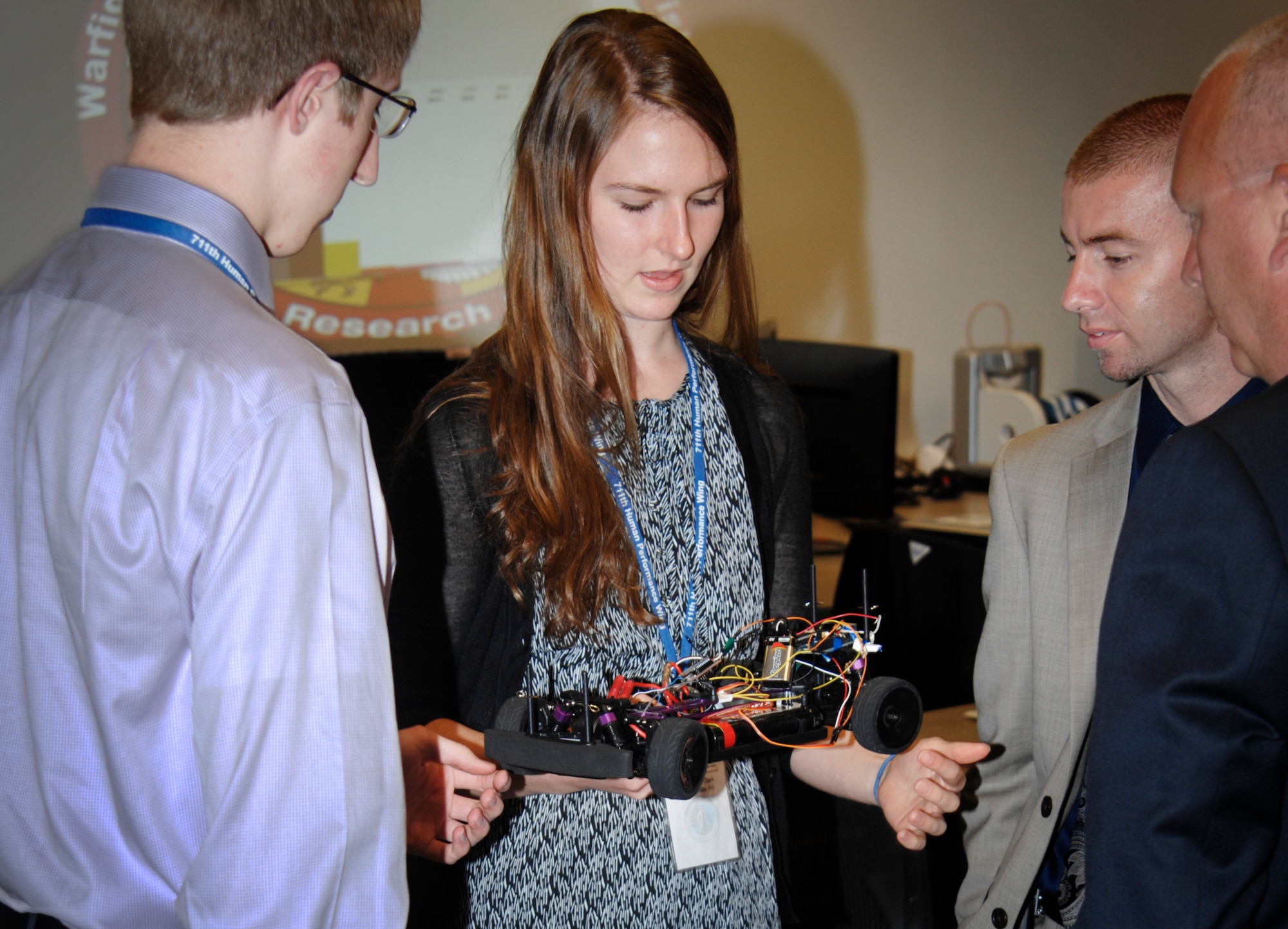 Kathleen Clark and Leland Merling , both former interns in the Wright Scholars program, practice their technical communication skills by presenting their project to local school administrators. (U.S. Air Force photo)
