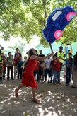 A Honduran girl strikes a piñata during Chapel Hike 65, Honduras, Dec. 12, 2015. Chapel hikes like this one help build bonds with local communities. (U.S. Air Force photo by Senior Airman Westin Warburton/Released)