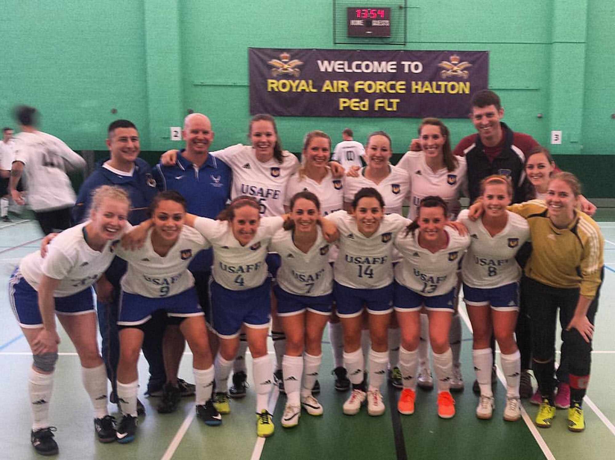 The U.S. Air Force Women’s Indoor Soccer Team poses for a photo after finishing third at the Headquarters Air Command Indoor Soccer Tournament Nov. 5, 2015, at Royal Air Force Halton, England. Senior Airman Tara Fadenrecht, front row, fourth from right, 22nd Air Refueling Wing Public Affairs photojournalist, was one of 12 members selected Air Force-wide to play for the team. (Courtesy photo)