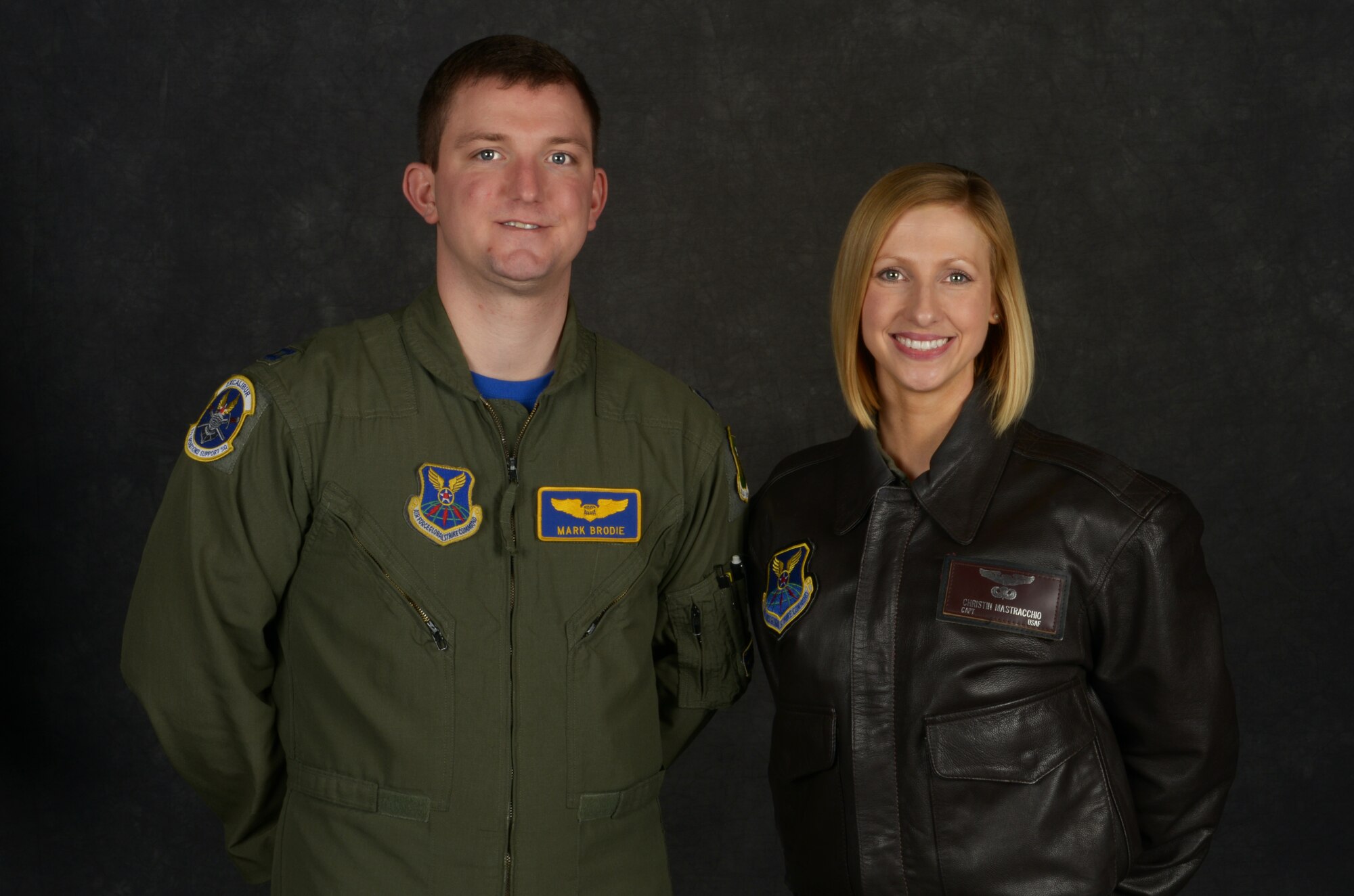 Capt. Mark Brodie, 5th Operations Support Squadron electronic warfare officer, and Capt. Christin Mastracchio, 69th Bomb Squadron flight commander, pose for a photo at Minot Air Force Base, N.D., Dec. 11, 2015. Both Brodie and Mastracchio were recently selected to attend the USAF Test Pilot School. (U.S. Air Force photo/Senior Airman Apryl Hall)