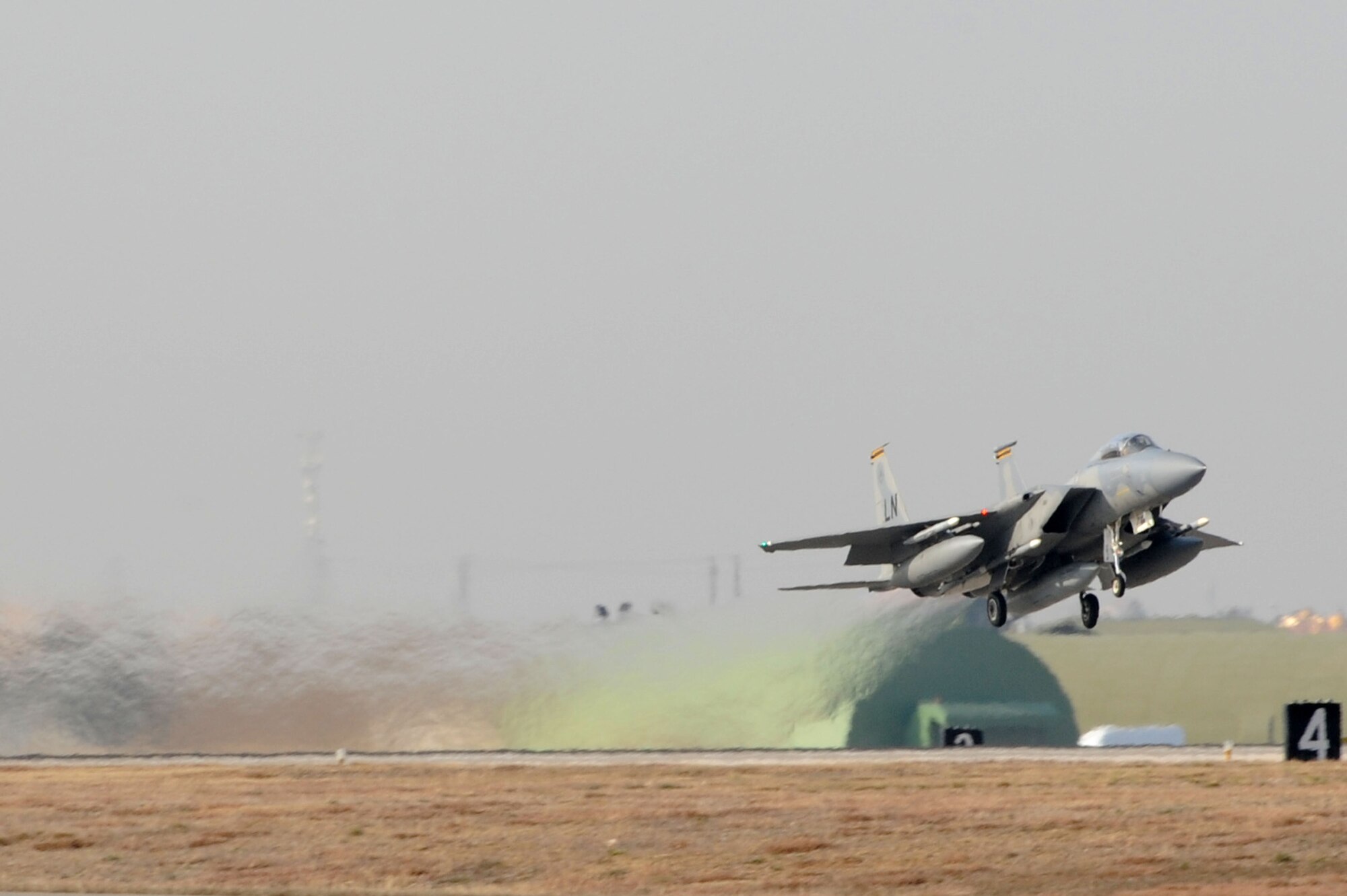 An F-15C Eagle from the 493rd Fighter Squadron departs Incirlik Air Base, Turkey, to return to RAF Lakenheath, UK, Dec. 16, 2015. The F-15C’s deployed to Incirlik to conduct combat air patrols in Turkish air space. The U.S. and Turkey, as NATO allies, share a commitment to peace and stability in the region. (U.S. Air Force photo by Tech. Sgt. Taylor Worley)