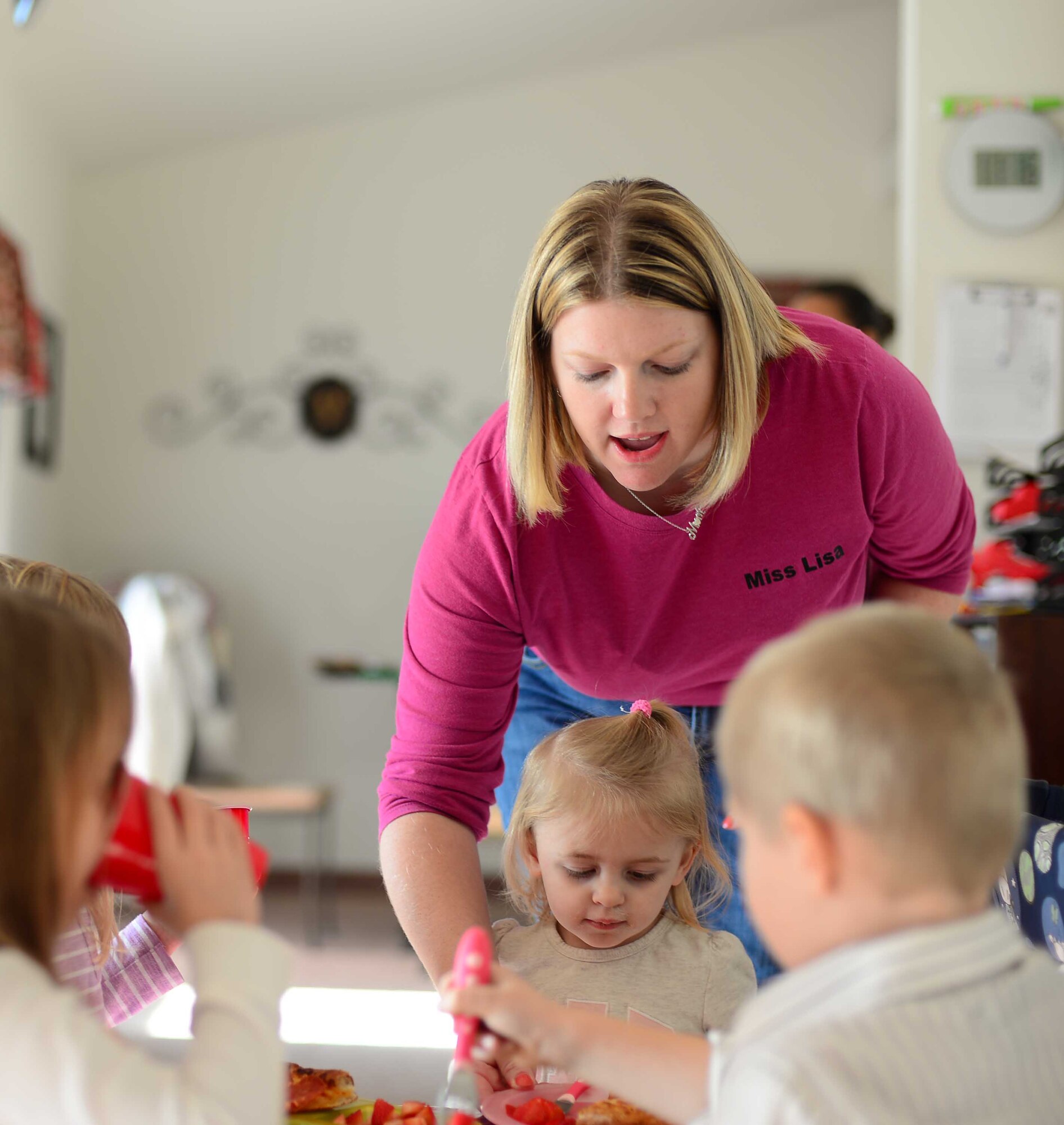 Lisa Maas, 341st Force Support Squadron Family Child Care provider, gives a pizza party for the children in her care Dec. 11, 2015, at Malmstrom Air Force Base, Mont. Maas received the Provider of the Year award by demonstrating high standards as a home dependent care provider and celebrated with her 341st Missile Wing family and friends. (U.S. Air Force photo/Airman 1st Class Magen M. Reeves)