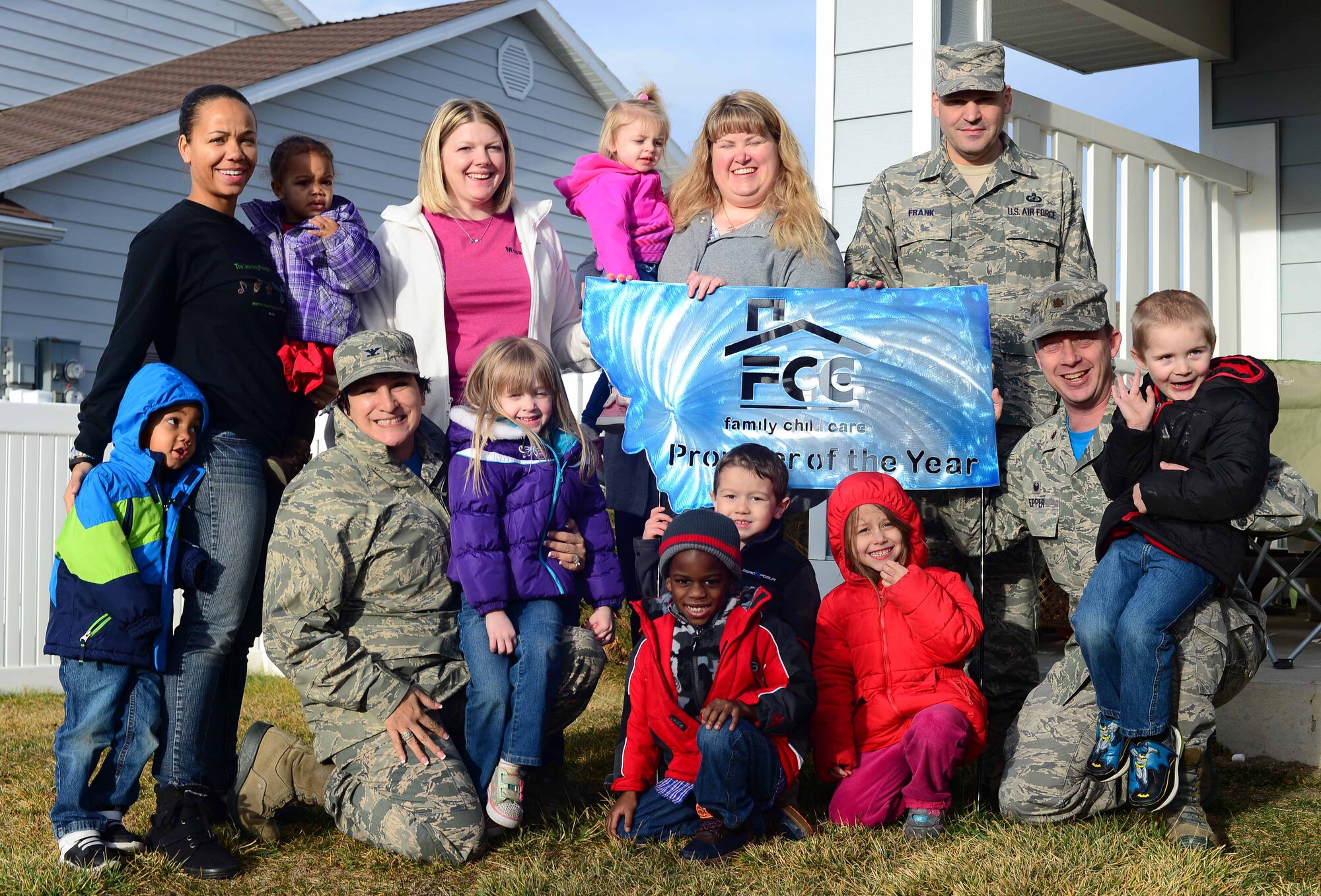 Lisa Maas, 341st Force Support Squadron Family Child Care provider, receives the Provider of the Year award Dec. 11, 2015, at Malmstrom Air Force Base, Mont. Air Force installations with a Family Child Care program nominate providers who exemplify high standards to be considered for the annual Air Force-wide award. (U.S. Air Force photo/Airman 1st Class Magen M. Reeves)