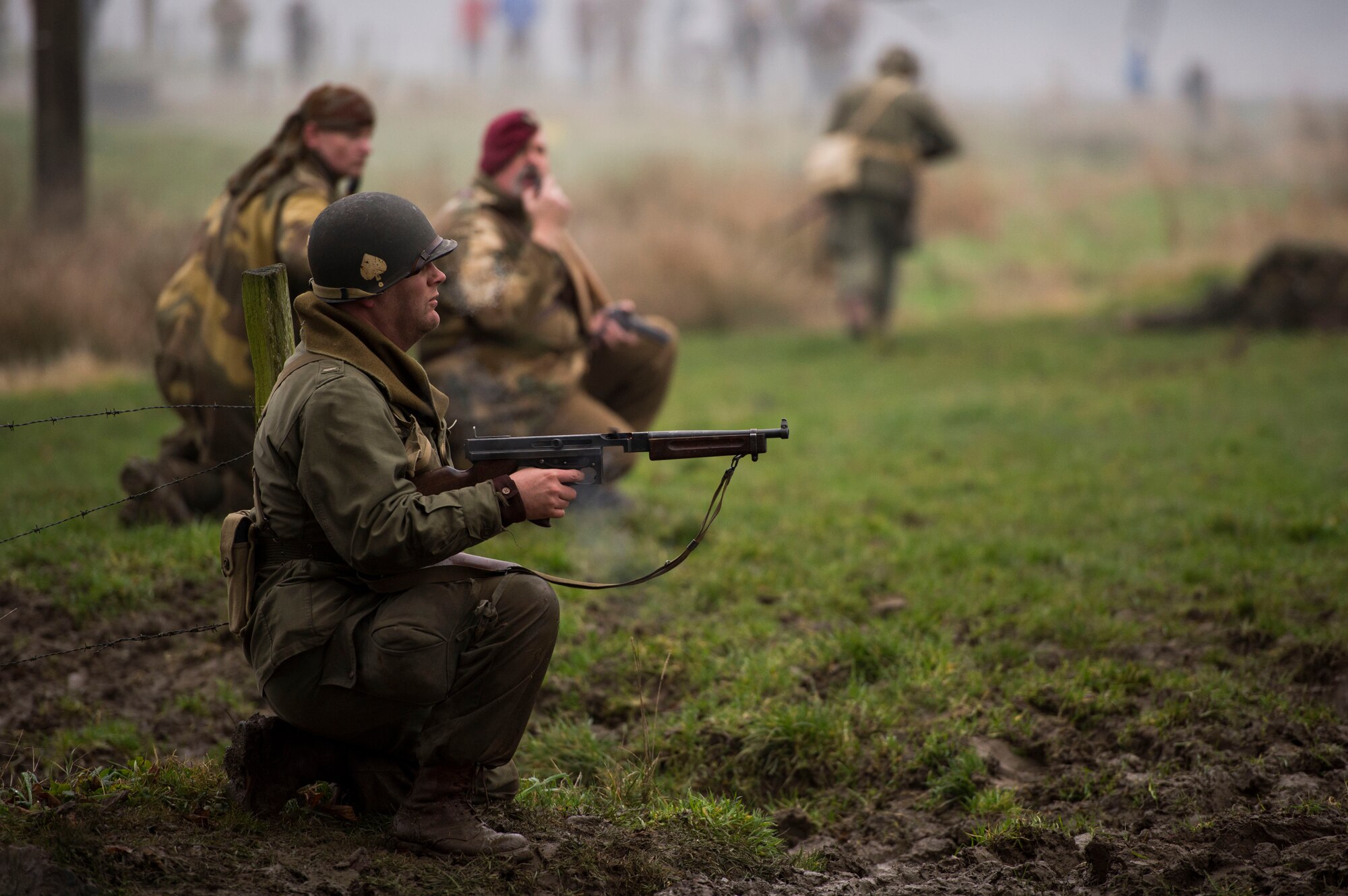 A WWII reenactment Allied Army soldier engages the Nazi army during Operation Desperate Stand, Dec. 13, 2015, in Bertogne, Belgium. More than 200 soldier actors participated in the Battle of the Bulge reenactment. (U.S. Air Force photo by Staff Sgt. Christopher Ruano/Released)